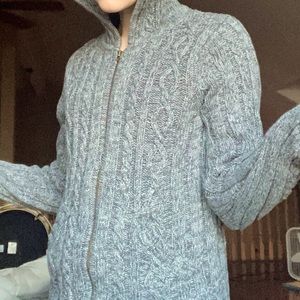 A grey knitted cotton hoodie/sweater